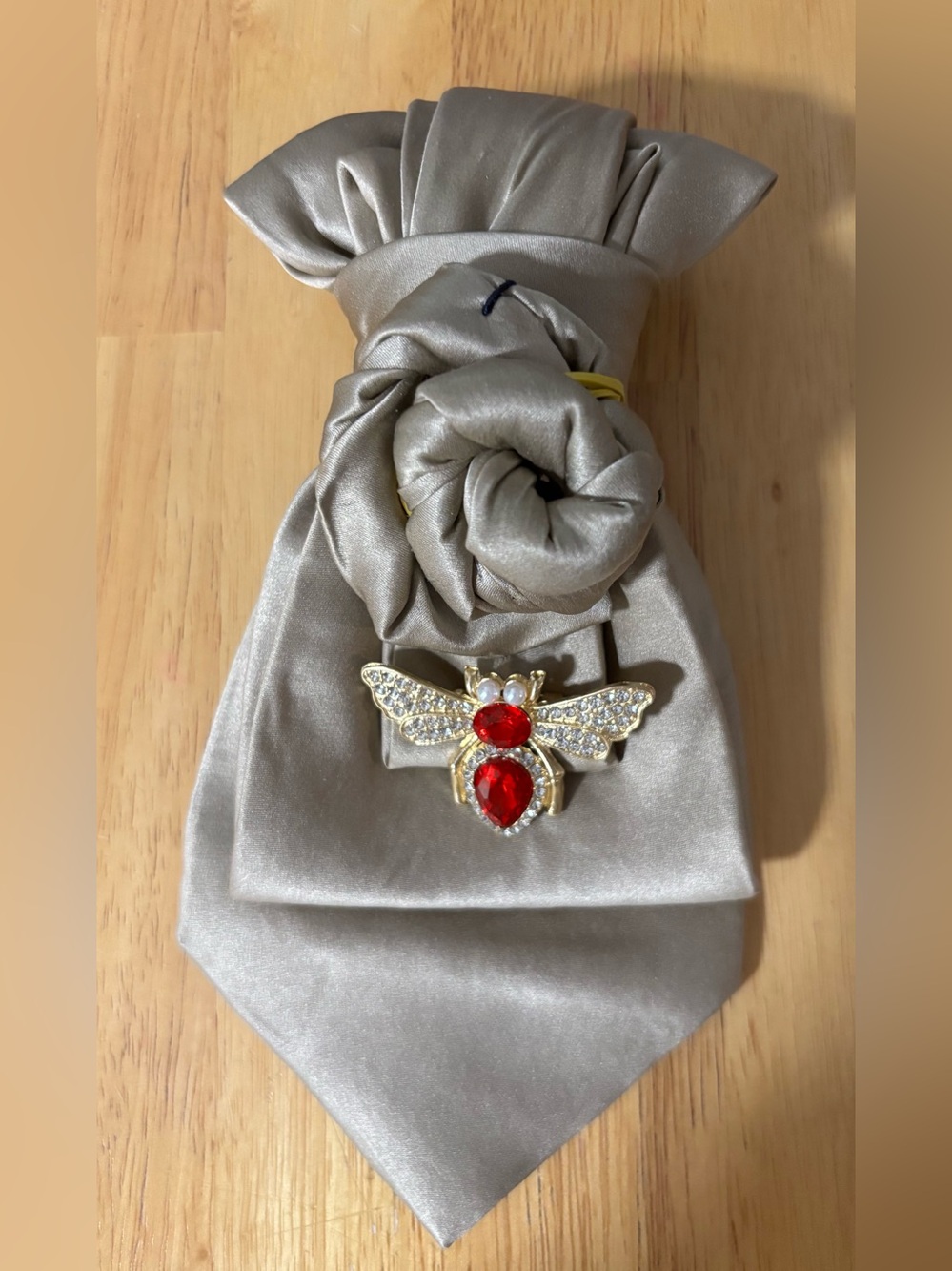 Gold Necktie Necklace with a bumblebee brooch.